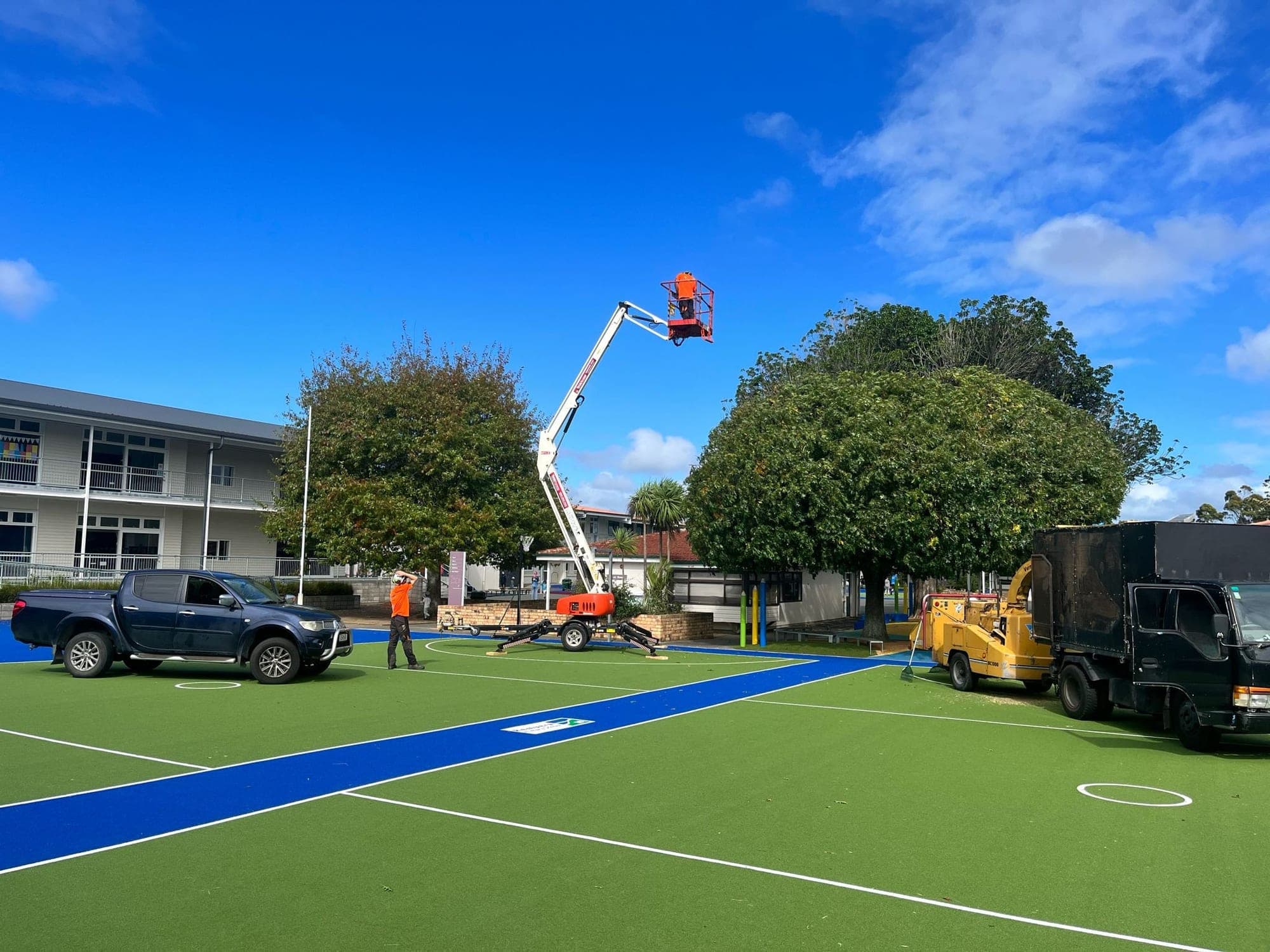 All-terrain tracked cherry picker set up for access work