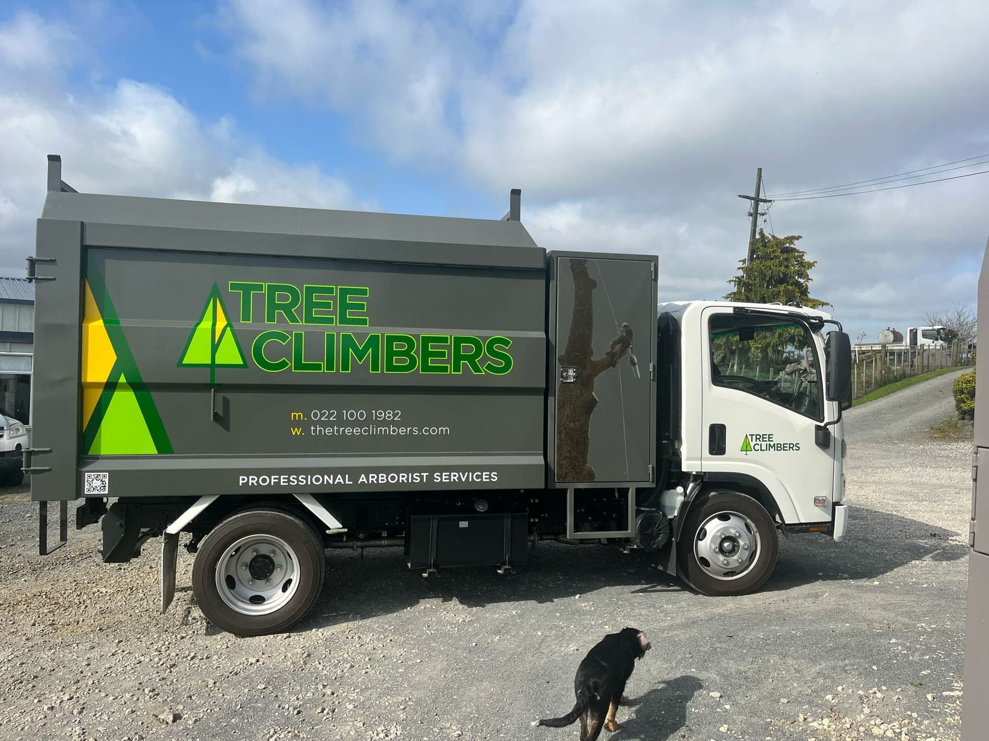 The Tree Climbers truck and chipper set up on a job site